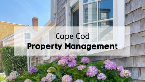 A close-up view of windows on a Cape Cod home, with the text, "Cape Cod Property Management," overlaid